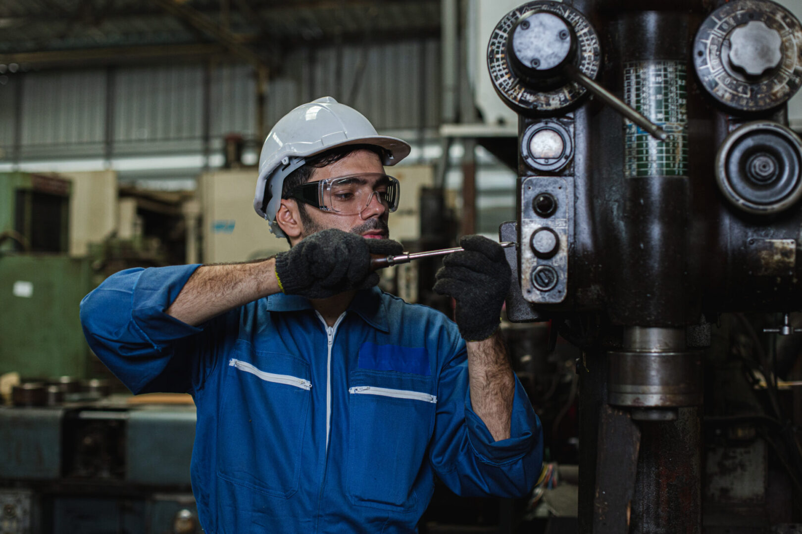 Engineer men wearing uniform safety in factory working repair machine.