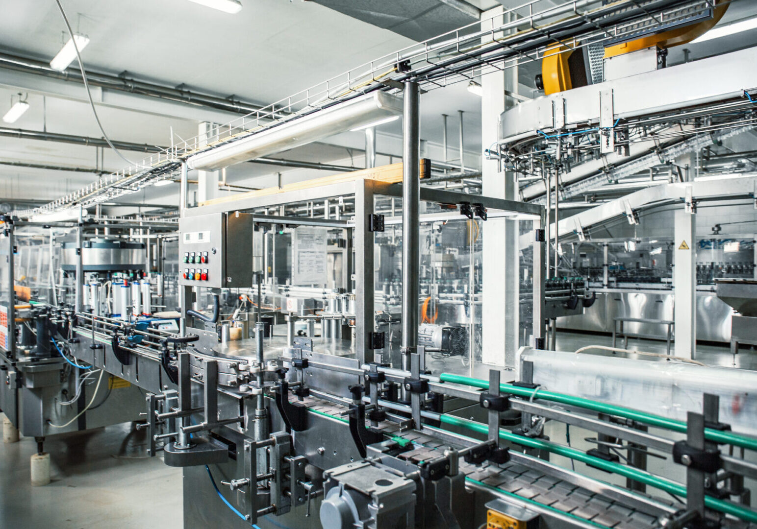 Industrial factory interior with equipment, conveyor line and steel tools, industry background, toned